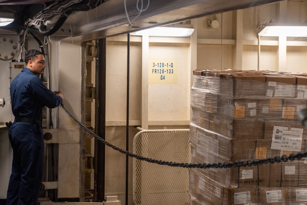 USS Ronald Reagan (CVN 76) Sailors operate freight elevators