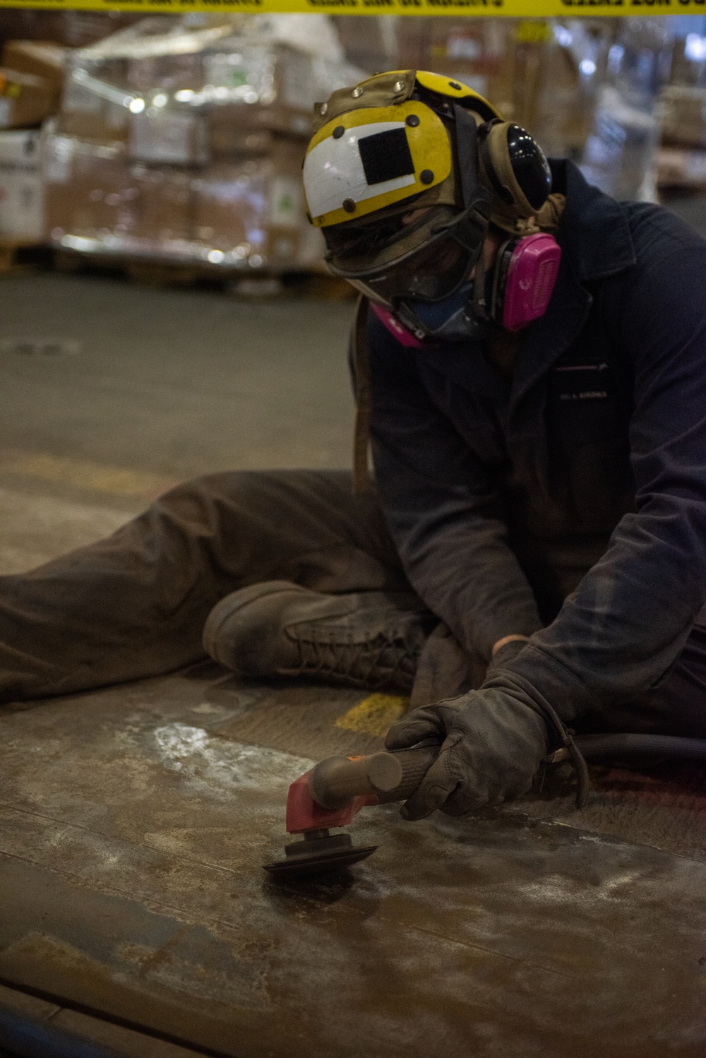 USS Ronald Reagan (CVN 76) Sailors conduct rust control and maintenance