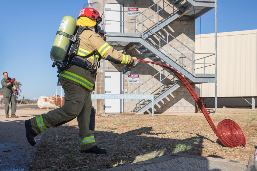 U.S. Marines, RAAF, and RNZAF firefighters conduct conditioning training