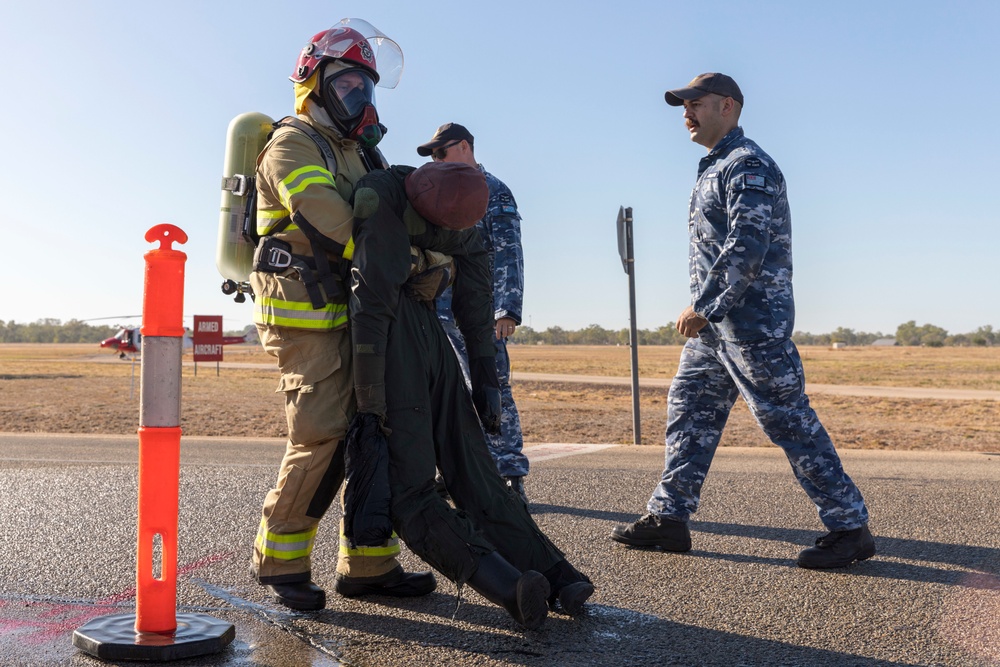 U.S. Marines, RAAF, and RNZAF firefighters conduct conditioning training