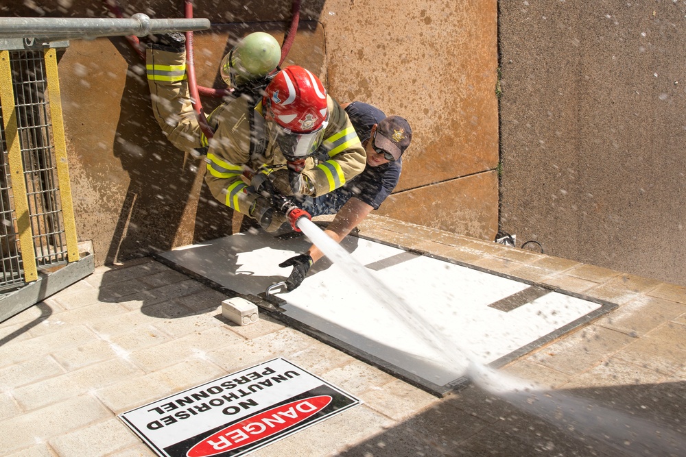 U.S. Marines, RAAF, and RNZAF firefighters conduct conditioning training