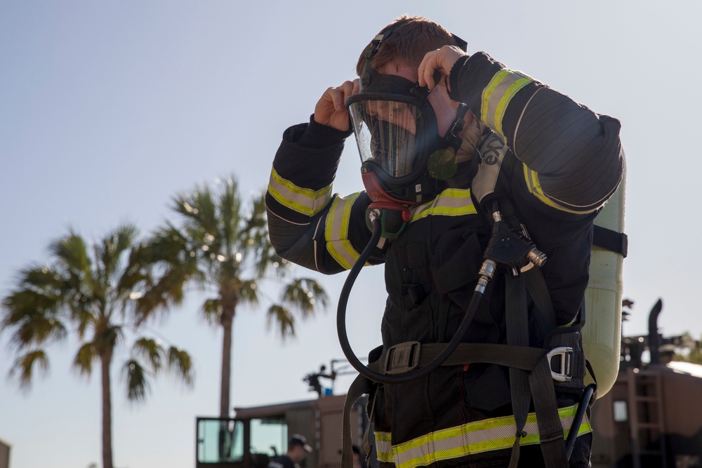 U.S. Marines, RAAF, and RNZAF firefighters conduct conditioning training