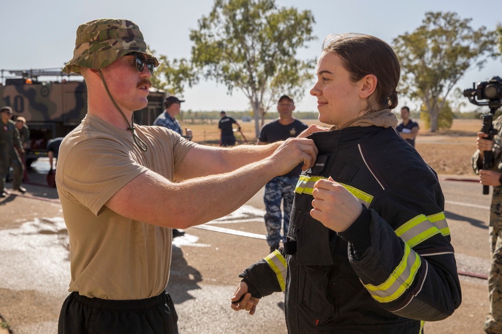 U.S. Marines, RAAF, and RNZAF firefighters conduct conditioning training