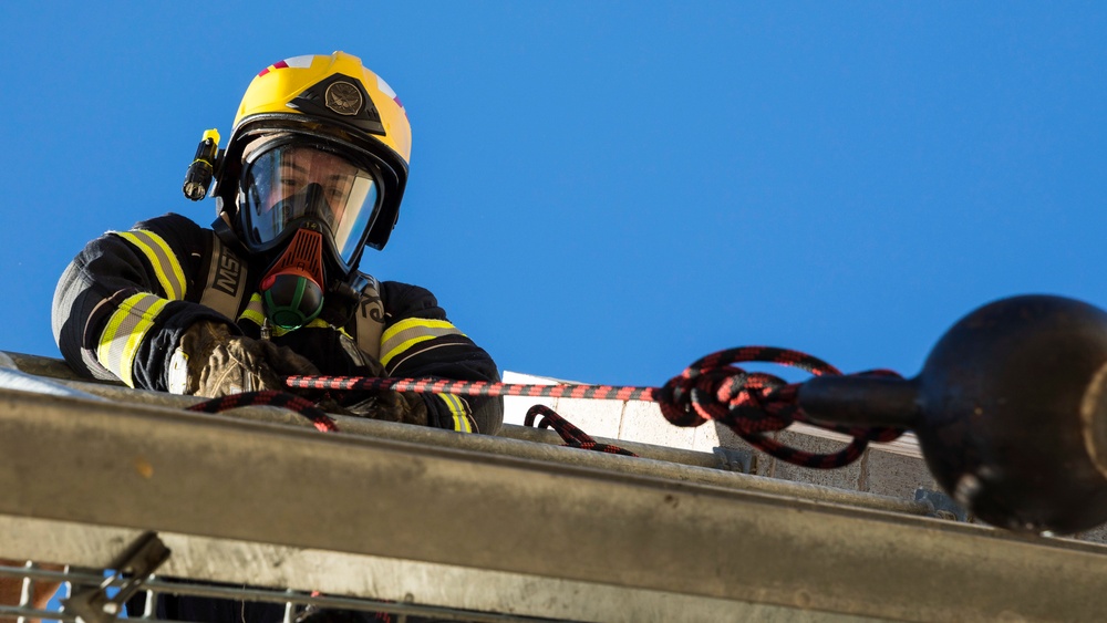 U.S. Marines, RAAF, and RNZAF firefighters conduct conditioning training