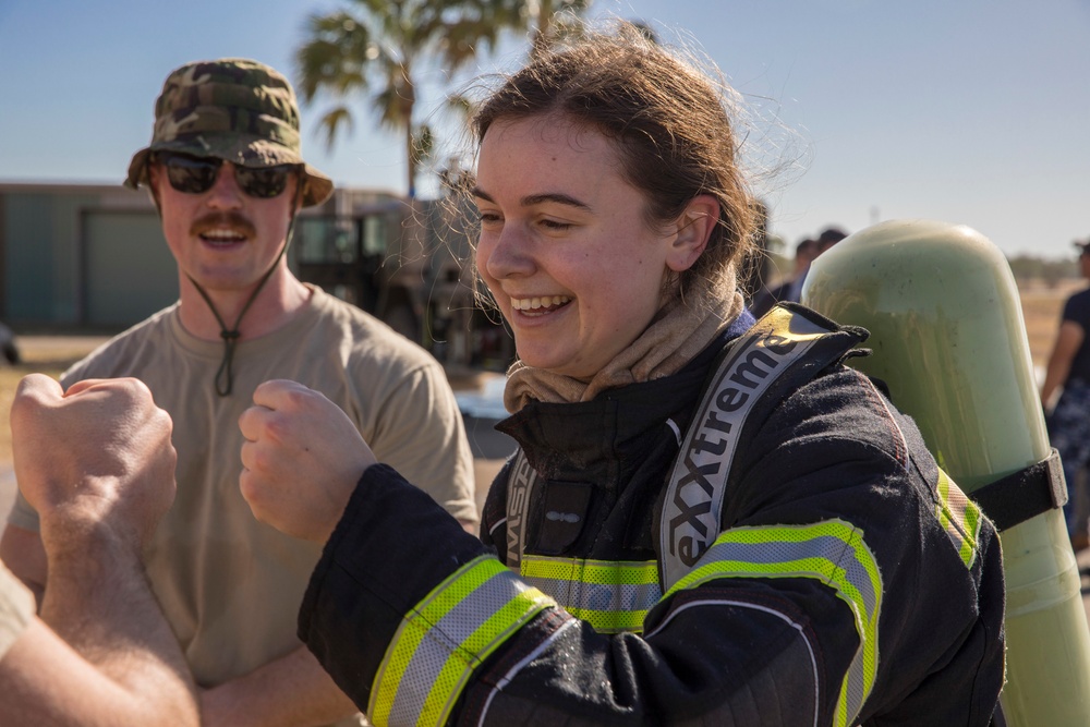 U.S. Marines, RAAF, and RNZAF firefighters conduct conditioning training