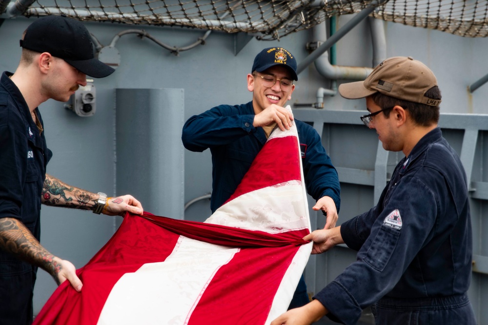 Sailors Fold Ensign