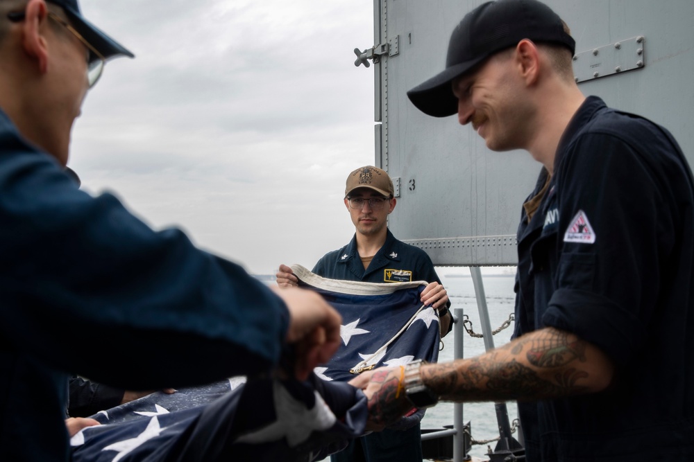 Sailors Fold Ensign