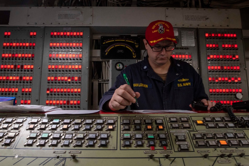 U.S. Navy Cmdr. Christopher Vanloenen Coordinates the Damage Control Team