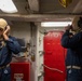 U.S. Navy Sailors talk on Sound-Powered Telephones