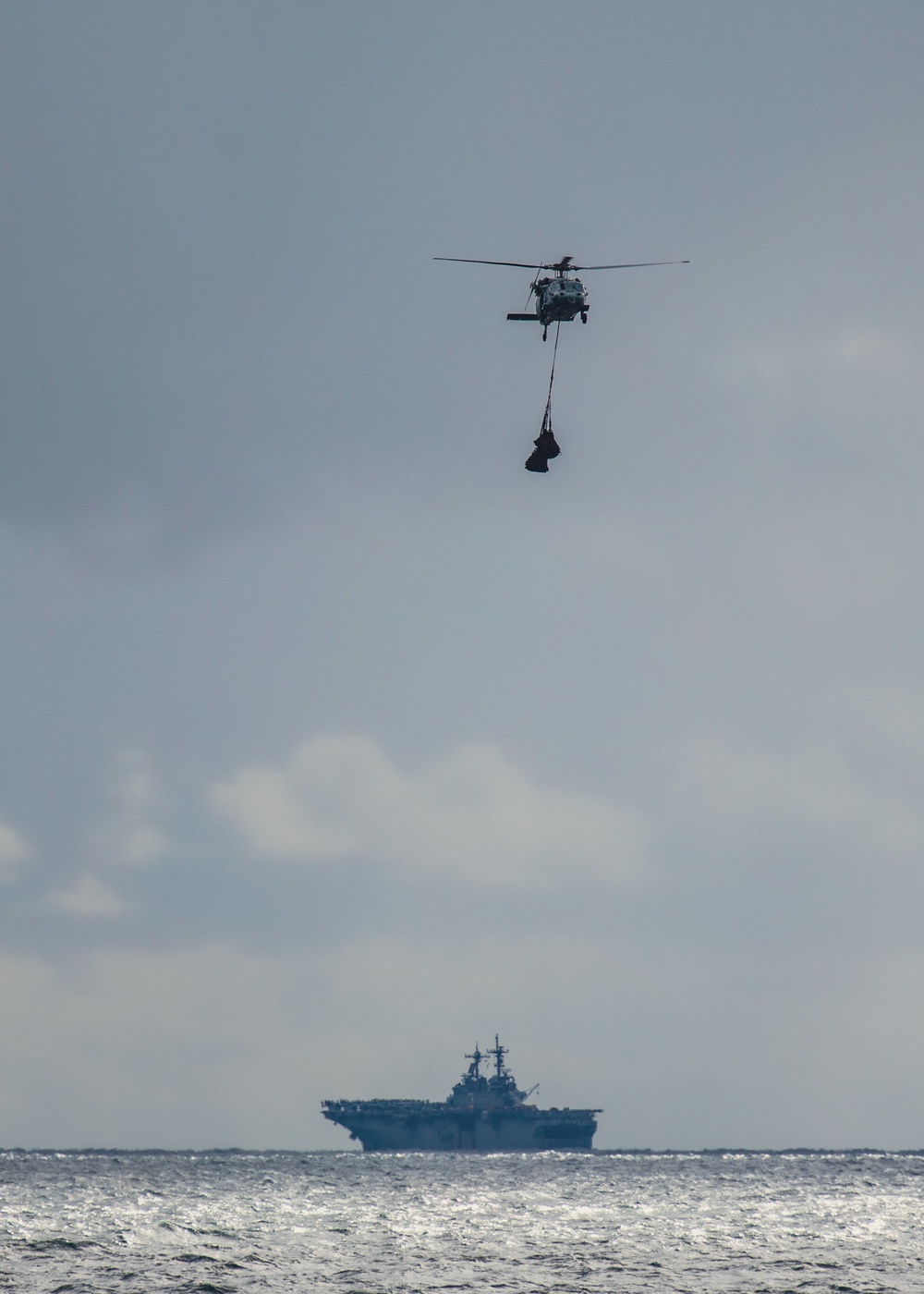 USS Kearsarge (LHD 3) and HSC 28 Conducts VERTREP with USNS William McLean (T-AKE 12)