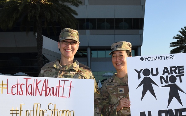 Space Base Delta 3 Commander, Colonel Mia Walsh, and Chief Master Sgt. Sarah Morgan raise suicide awareness for suicide prevention September