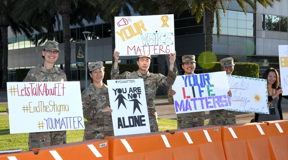 Space Base Delta 3 Commander, Colonel Mia Walsh, Chief Master Sgt. Sarah Morgan, Guardians, Airmen, and civilians raise suicide awareness for suicide prevention September