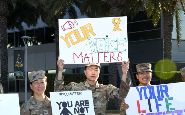 Space Base Delta 3 Commander, Colonel Mia Walsh, Chief Master Sgt. Sarah Morgan, Guardians, Airmen, and civilians raise suicide awareness for suicide prevention September