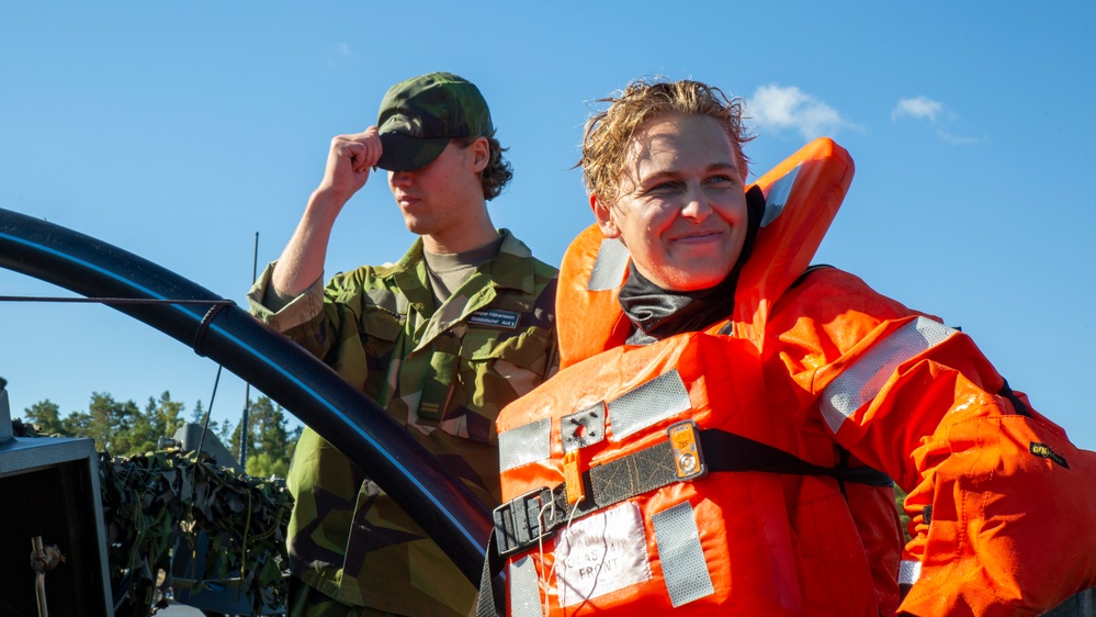 U.S. Marines follow safety demonstrations aboard a Swedish Combat Boat 90