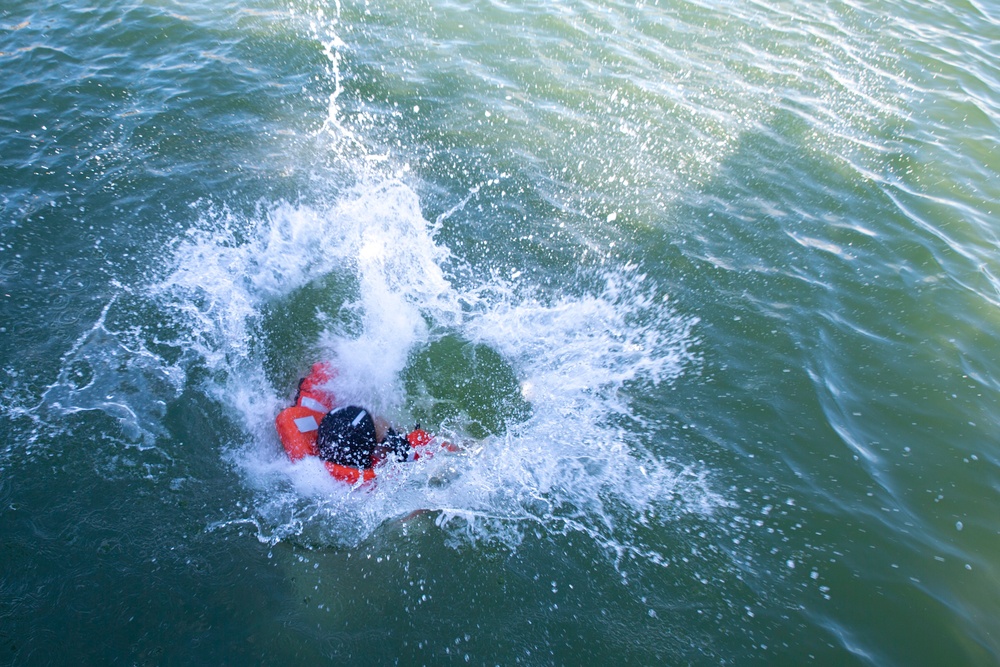 U.S. Marines follow safety demonstrations aboard a Swedish Combat Boat 90