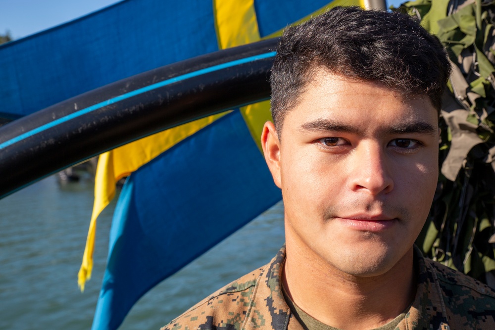 U.S. Marines follow safety demonstrations aboard a Swedish Combat Boat 90