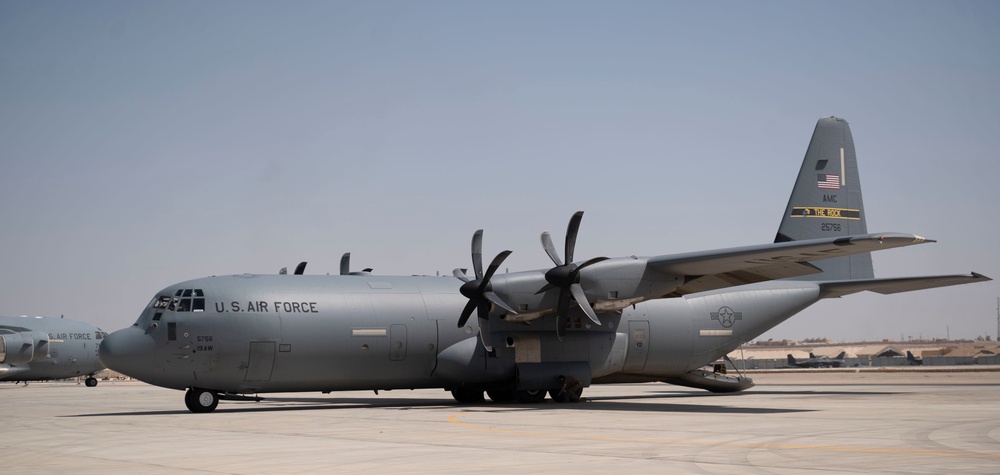 332d Expeditionary Logistics Readiness Squadron loads cargo onto C-130 Hercules