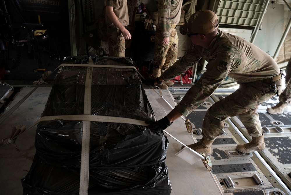 332d Expeditionary Logistics Readiness Squadron loads cargo onto C-130 Hercules