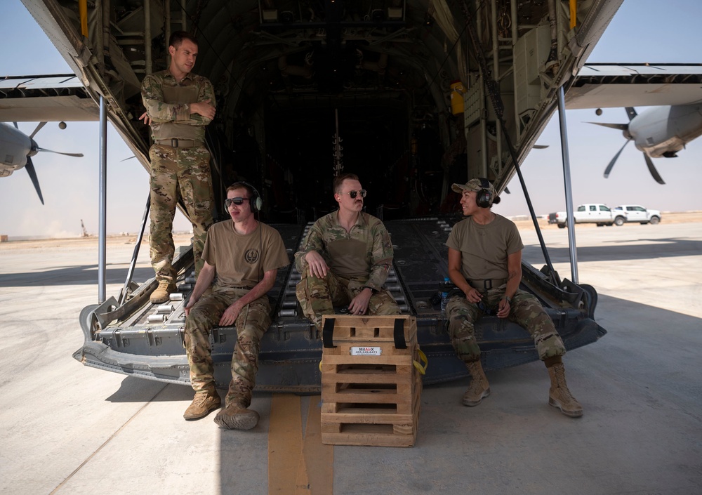 332d Expeditionary Logistics Readiness Squadron loads cargo onto C-130 Hercules