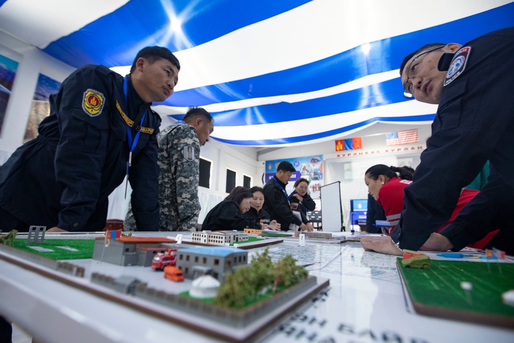 Mongolian officials work table top scenarios during exercise Gobi Wolf 2022