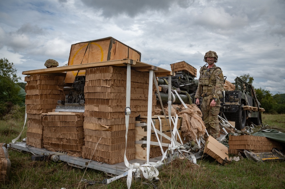 U.S. Army Paratrooper Unpacks M119 after an Airborne Operation