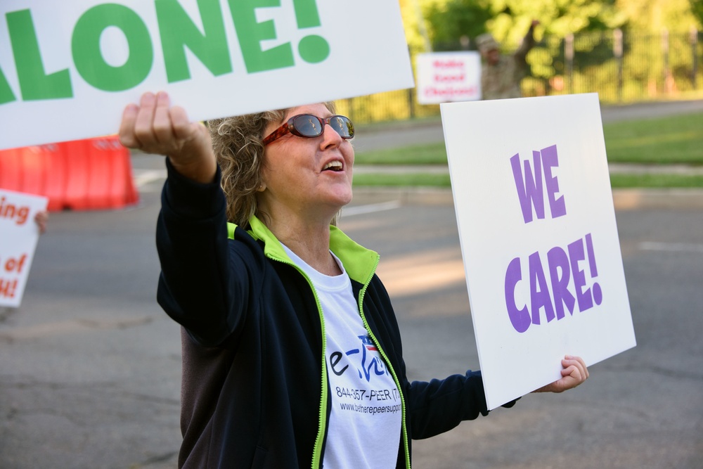 Joint Base MDL leadership promote suicide prevention awareness one sign at a time