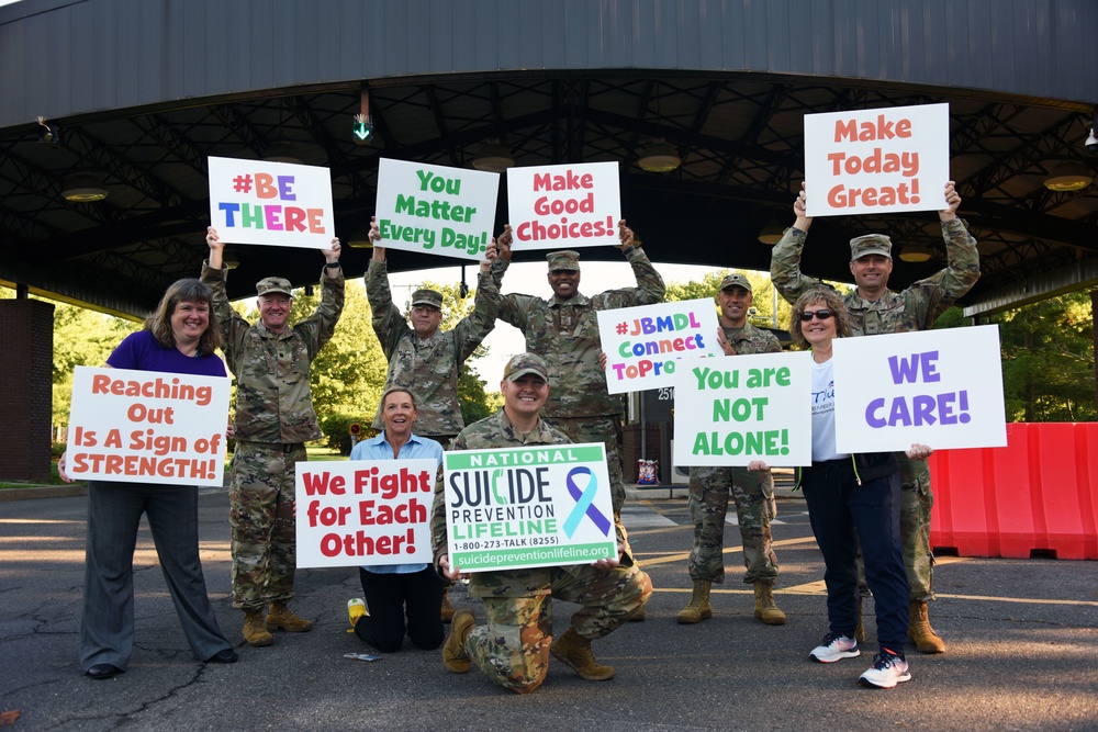 Joint Base MDL leadership promote suicide prevention awareness one sign at a time