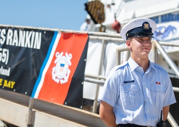 Seaman Apprentice Matthew Forrester Stands Watch Next to USCGC James Rankin