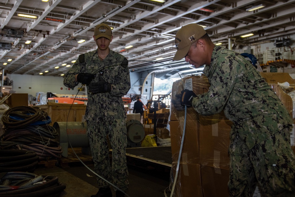 USS Ronald Reagan (CVN 76) Sailors prepare equipment for transfer