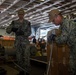 USS Ronald Reagan (CVN 76) Sailors prepare equipment for transfer