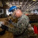 USS Ronald Reagan (CVN 76) Sailors prepare equipment for transfer