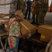 USS Ronald Reagan (CVN 76) Sailors on load cargo in hangar bay