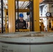 USS Ronald Reagan (CVN 76) Sailors on load cargo in hangar bay