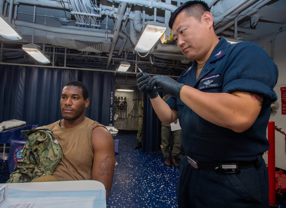 USS Ronald Reagan (CVN-76) administers Covid-19 booster shots