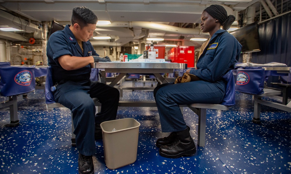 USS Ronald Reagan (CVN-76) administers Covid-19 booster shots