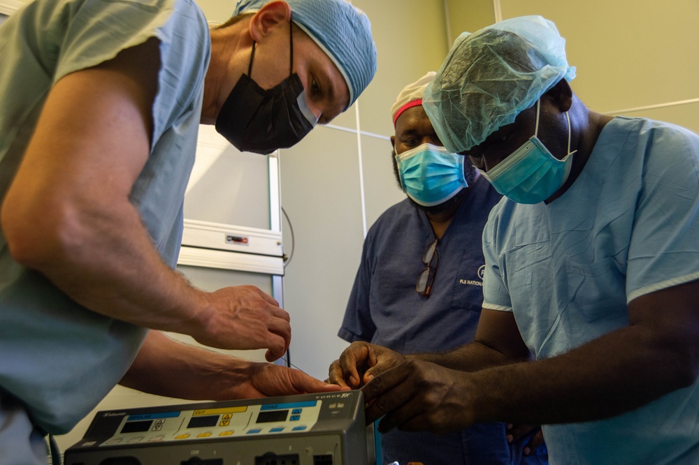 U.S. Navy doctors perform side-by-side surgery at the Gizo Medical Hospital