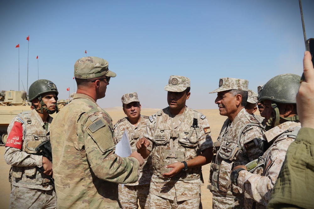 U.S. soldier briefs Brig. Gen. Abdullah Al-Shdaifat, Deputy Commanding General, Operations and Training, and his staff prior to conducting a situational training exercise (STX) during Exercise Eager Lion