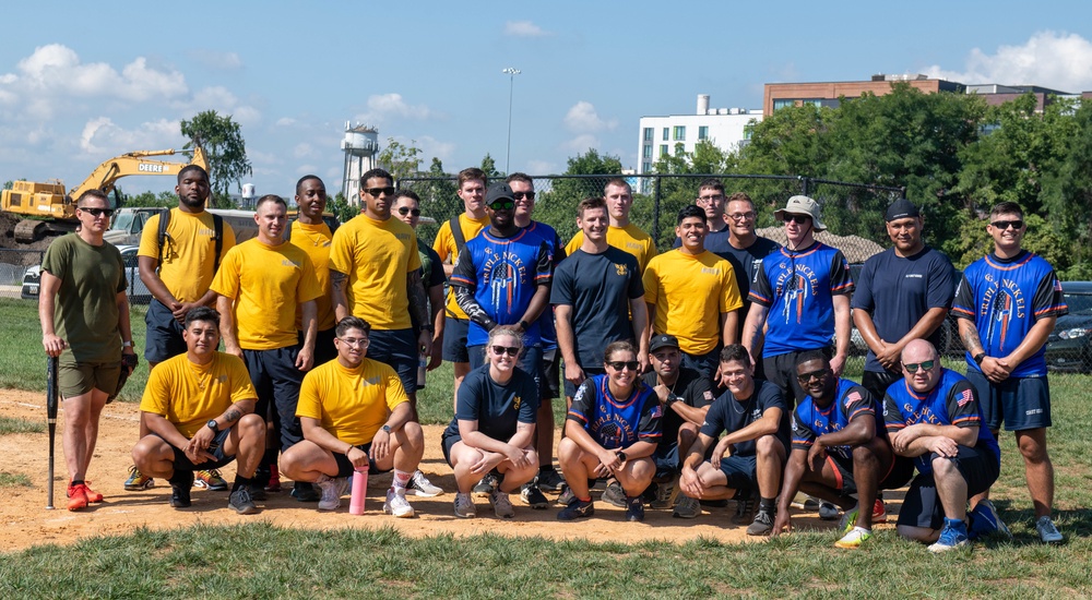 U.S. service members taking a photo after a softball game during Maryland Fleet Week