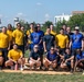 U.S. service members taking a photo after a softball game during Maryland Fleet Week