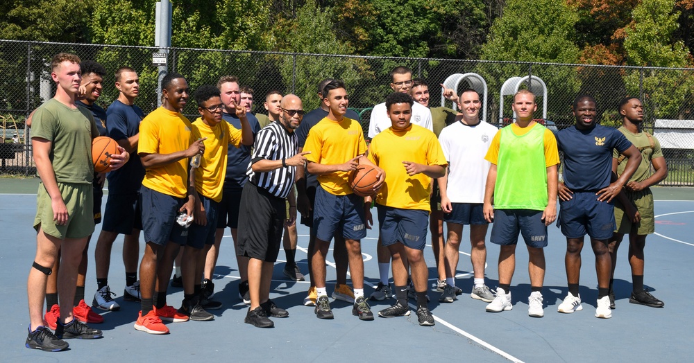 U.S. Service members take photo after basketball game at Latrobe Park in Baltimore during Maryland Fleet Week