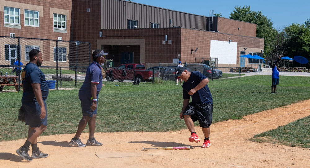 U.S. Service members play softball at Latrobe Park in Baltimore during Maryland Fleet Week