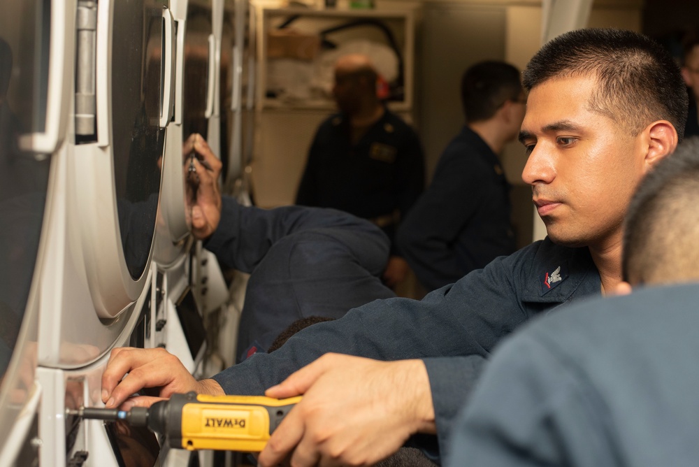 Sailors fix washing machines
