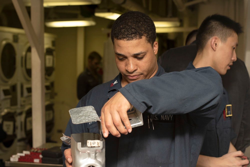 Sailors fix washing machines