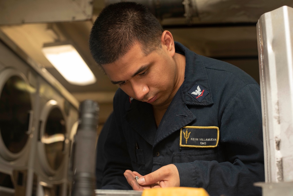 Sailors fix washing machines