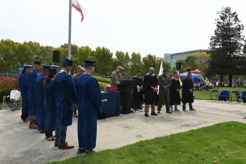 A Career Milestone | 129th Rescue Wing Airmen are recognized for achieving an associate’s degree from the Community College of the Air Force during a commencement ceremony