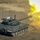A main battle tank is captured mid-fire, with a large muzzle blast of yellow and white flame erupting from the gun barrel. The tank bears the marking 'D/A-01' on its turret and is positioned on bare, dry terrain. The image captures the moment of cannon discharge with high visual detail.