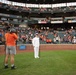 Musician 1st Class Robert A. Kurth sings the National Anthem at Orioles Park to celebrate Maryland Fleet Week