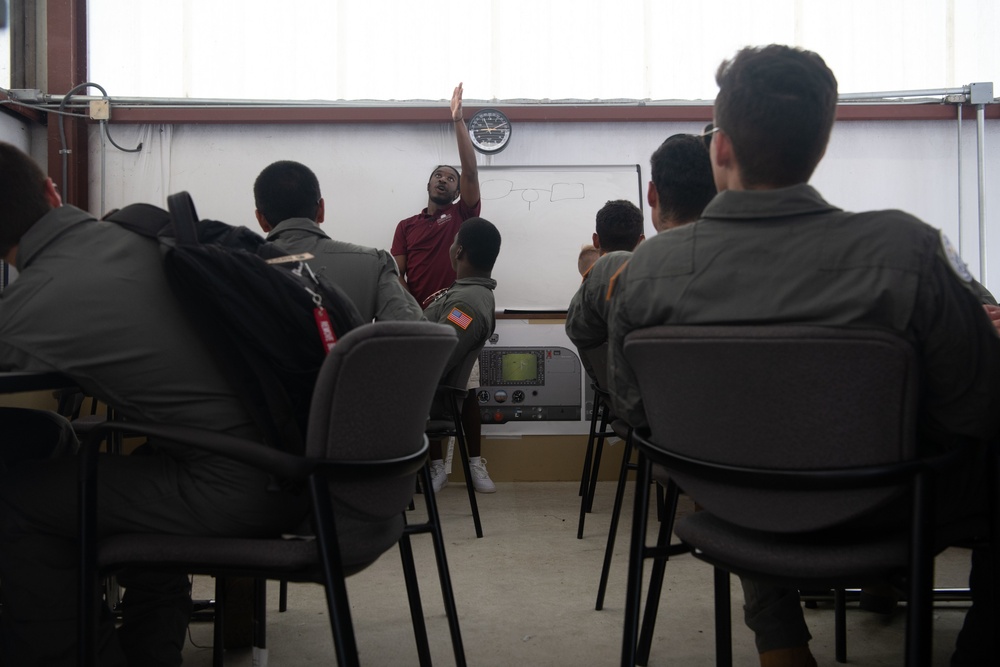 College student teaches cadets how to fly