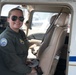 Cadet poses for photo in plane