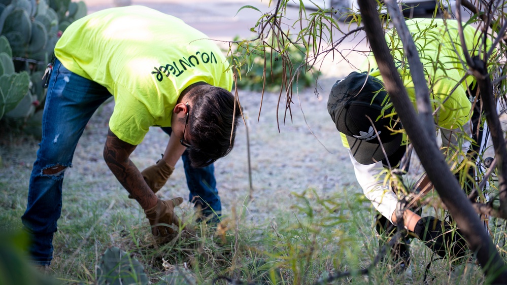 Holloman volunteers help clean surrounding communities during the Day of Caring